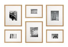 six black and white photographs hanging on a wall with wooden frames in front of them