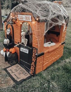 an orange and white halloween hut with skeleton decorations