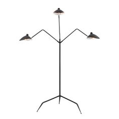 the three light floor lamp is black and has two lamps on each side, one with an