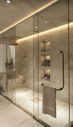 an elegant bathroom with marble walls and flooring