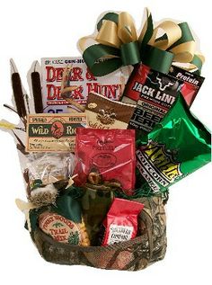 a basket filled with lots of different types of snacks and candys on top of a table