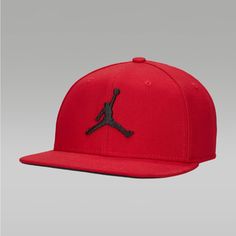 Elevate Your Street Style With This Jordan Pro Cap Adjustable Hat. Crafted With A Solid Red Pattern, This Snapback Hat Is Perfect For Travel Or Casual Occasions. The Hat Features An Adjustable Strap For A Comfortable Fit And Is Available In M/L Representing The Jordan Brand, This Hat Is A Must-Have Accessory For Any Stylish Man. Whether You're Hitting The Road Or Just Running Errands, This Hat Will Complete Your Look. Don't Miss Out On This Opportunity To Add A Touch Of Style To Your Wardrobe. Jordan Hats Snapback, Jordan Cap, Red Six-panel Snapback Hat For Sports Events, Red Six-panel Fitted Sports Hat, Red Six-panel Snapback Hat For Baseball Season, Jordan Red, Stylish Man, Solid Red, Red Pattern