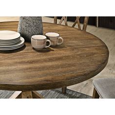 This type of base is known for its crossed wooden supports, which are reminiscent of antique barn doors. It provides a sturdy foundation for the table while adding a rustic charm to its design. his would suggest that the table is of a size that allows for intimate meals with family or close friends. Perfect for small gatherings or everyday meals, it offers enough space to dine comfortably while maintaining a cozy atmosphere. This combination of a cross-buck pedestal base with a seating capacity Farmhouse Round Dining Table, Circle Dining Table, Black Round Dining Table, Wooden Kitchen Table, Round Dining Room Sets, Round Table And Chairs, Round Dining Room Table, Round Dining Table Sets, Round Dining Room