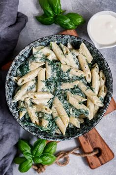 pasta with spinach and cheese in a bowl