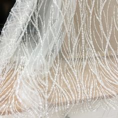 Luxury 3D heavily Beaded flower Tulle Embroidery Lace Fabric, Retro Couture Dress Bridal Gown Wedding Lace by Yard Haute Couture 3D flower lace fabric for wedding DIY , with tone of seed pearls and clear sequins graceful ivory in color Price is for one yard ,more buying will be cut as one piece Haute couture bridal wedding gown fabric, ideal for wedding dress,bridal gown, haute couture fabric, runway fabric, vintage style costumes . my shop link: http://www.etsy.com/shop/lacetime --------------- Floor-length Organza Tulle For Wedding, Embellished Tulle Sequin Fabric For Wedding, Wedding Embellished Tulle Sequin Fabric, Elegant Sparkling Tulle Fabric For Wedding, Embellished Tulle Fabric For Wedding, Floor-length Embellished Sequin Fabric For Weddings, Wedding Sequined Embroidered Floor-length Fabric, Floor-length Embroidered Fabric With Sequins For Wedding, Wedding Embroidered Sequins Floor-length Fabric