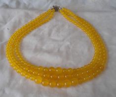 PREFERENTIAL POLICIES : The order is $35 or more.There will be a 10% discount. long-term effective. Please use the coupon code: CZH10 Welcome back to my shop: https://www.etsy.com/shop/pearlandjewelry Description of the product in the picture: The necklace lengh is 17 -19 inches ,I make the necklace to use 6mm 8mm and 10mm pure natural yellow jade, 3 strands necklace, IT is good necklace for your great wedding. Pearl Jewelry: necklace Pearl Type: jade bead color: yellow size: 6mm 8 mm 10mm lengt Yellow Beaded Necklaces With Round Beads For Weddings, Elegant Yellow Beaded Necklaces For Weddings, Yellow Round Beads Necklace For Wedding, Amber Round Wedding Necklaces, Handmade Yellow Necklaces For Wedding, Wedding Pearl Jewelry, Ivory Pearl Necklace, Jade Bead Necklace, Pink Pearl Necklace