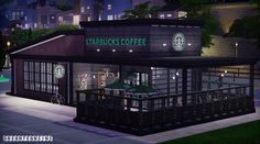 the starbucks coffee shop is lit up at night