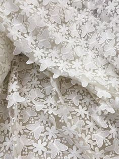 white lace fabric with flowers on it