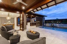 a living room with a pool in the background