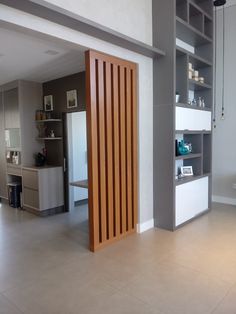 an empty room with some shelves and cabinets in it