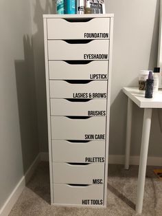 a tall white cabinet with lots of hair products on it