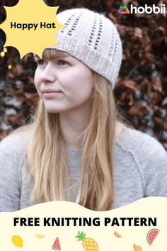 a woman wearing a knitted hat with the words happy hat hoobi on it