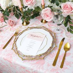 a table setting with pink roses and gold place settings for an elegant dinner party or brunch