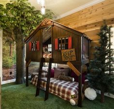 a house made out of wood and some plants