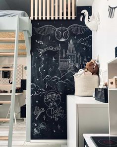 a child's room with a chalkboard wall and bunk bed in the corner