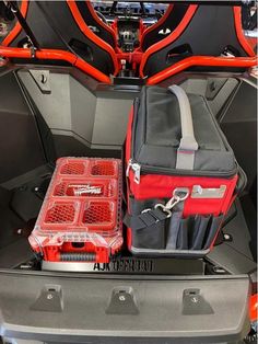 the back end of a car with luggage in it's trunk and two bags on top