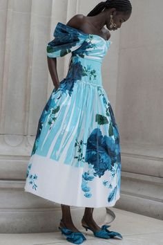 Off Shoulder Full Skirt Cocktail Dress in Kingfisher by Erdem Evocative of the vintage couture dresses favoured by the muse Deborah Cavendish, the dress cuts a statement silhouette. It is made from cotton faille that's printed with a bold, oversized floral in rich shades of blue. Draped sleeves and a full, gathered skirt are balanced by a flattering fitted bodice. The raw hem adds an element of laidback charm. PLEASE NOTE ALL SALE ITEMS ARE FINAL SALE Cocktail Dress Spring Blue, Vintage Blue Cocktail Dress, Erdem 2024, Erdem Menswear, Erdem Spring 2024, Erdem Blue Dress, Luxury Off-shoulder Floral Print Midi Dress, Drape Sleeves, Straight Leg Denim