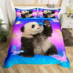 a panda bear with butterflies on it's head is sitting in the middle of a bed