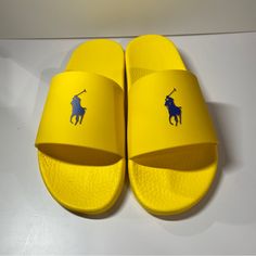 Mens Polo Ralph Lauren Signature Pony Slide Color: Yellow /Navy Men’s Size 13 Condition: Brand New No Box Note: Slight Intention On Front Of Right Slide, See Pictures. Usps Priority Mail Shipping 1 Day Processing Yellow Slides With Rubber Sole And Round Toe, Yellow Slides With Round Toe And Rubber Sole, Yellow Non-slip Slides With Round Toe, Yellow Non-slip Round Toe Slides, Yellow Non-slip Slides, Yellow Sporty Slides For Summer, Yellow Cushioned Slides With Round Toe, Yellow Flat Casual Slides, Casual Yellow Flat Slides