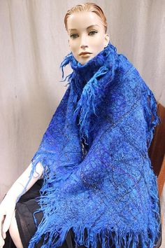 Shawl with wool,acrylic,cotton,mohair and silk threads- embroidered together . Decorated with saphire and purple silk ribbons and golden threads. Embellished with Swarovski golden crystals  Amazing vibrant ,new colour- fresh and young. perfect with gray, brown and black coat  light and Blue Bohemian Handwoven Shawl, Handmade Blue Shawl For Winter, Handmade Wool Scarves In Bohemian Style, Bohemian Wool Scarves Handmade, Bohemian Handmade Wool Scarves, Handmade Mohair Shawl Scarf, Handmade Artisan Shawl For Winter, Artistic Handmade Shawl Scarf, Artisan Handmade Scarves For Winter