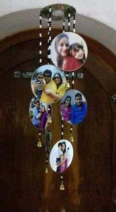 a wooden door with some pictures hanging from it's side and beads on the front