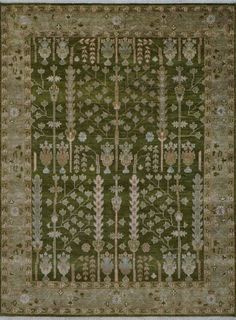 a green rug with flowers and leaves on the bottom, surrounded by smaller floral designs