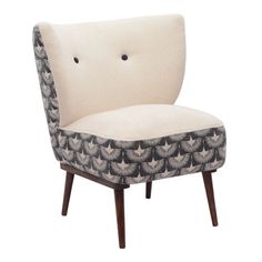 an upholstered chair with black and white designs