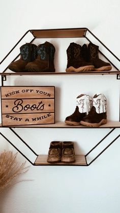 two shelves with shoes and a sign that says kick off your boots stay a wild