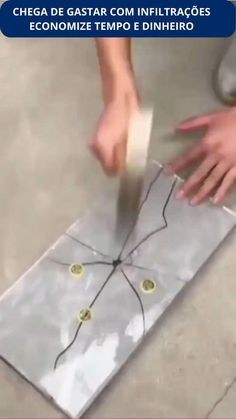 a person is using a knife to cut up some paper on the floor with scissors