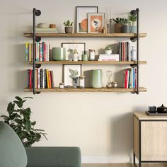 a living room filled with furniture and bookshelves next to a wall mounted shelf