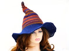 Ready for the Renfaire, a festival, cosplay, a witch gathering, your table centerpiece, or just plain fun, this quirky fairy witch hat is firmly shaped but soft to wear. Do you like to put a bit of fun in your spell casting or capture that impish look with your outfits? This hat is full of character and sure to help express a bit of that impish quirky fun! I've done this one in Fall colors and shaped it with a stacked twisted tip. The quirky wide brim has an open weave stitch for ventilation, giving it an airy mesh look, and done in a midnight sparkle blue lending a night sky feel. The way I stitch allows you to twist and shape or return it to straight up. The brim is wired and can be made more or less funky in shape. When you're not wearing it, you can toss it on your table for a great ce Witch Gathering, Midnight Sparkle, Fairy Witch, Wizard Hat, Spell Casting, Spell Cast, Costume Hats, Open Weave, Witch Hat