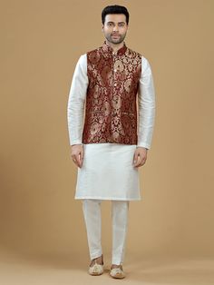 A gold zari brocade vest to pair with any kurta with statement button closures at the front. Occasion: Style this vest with pajama pants and a kurta for a welcome dinner or sangeet night, or style it with a any dress shirt and trousers for a sleek Indian wedding reception look! WASH CARE INSTRUCTIONS - Please Dry clean only. Slight color variation is possible due to digital photography. **Kurta & Pajama not included Sleeveless Bandhgala For Eid, Sleeveless Bandhgala For Festivals, Sleeveless Nehru Jacket For Diwali, Bollywood Brocade Nehru Jacket For Festive Occasions, Traditional Sleeveless Nehru Jacket For Festive Occasions, Gold Nehru Jacket For Festivals, Straight Kurta Style, Festive Brocade Nehru Jacket, Traditional Sleeveless Kurta For Festivities, Sleeveless Nehru Jacket With Zari Work For Festivals