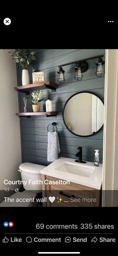 the bathroom is decorated in shades of gray and white, with shelves above the sink