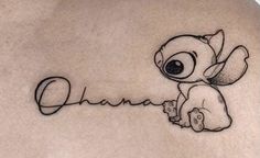 the back of a woman's stomach with a tattoo on it that says, ohana