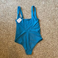 Lulu One-Piece Swimsuit * Size 10 (Fits True To Size) * Color “Marlin” (Rly Pretty Teal Blue) * New With Tags Perfect Condition, Never Worn, Still Has All Tags And The Sanitary Liner :) * Smoke Free Home * Bought Online A Few Months Ago And Just Didn’t Love The Style On My Body Super Flattering Design Though! Blue Nylon Sports Bodysuit, Blue Lined Sports Bodysuit, Sporty Solid Leotard For Summer, Sporty Solid Color Summer Leotard, Blue Summer Swimwear For Workout, Blue One-piece Swimwear For Workout, Summer Sports Scoop Neck Bodysuit, Athleisure Bodysuit For Poolside, Summer Sports Bodysuit With Scoop Neck