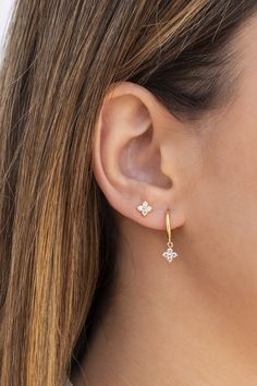 The Gentian Hoop are huggie hoop earrings with a flower shaped charm with cubic zirconias. These dainty, modern and minimalist-style earrings can be worn daily as well as on special occasions. Perfect for a gift! Features: * Inner diameter: 9 mm. * Two charm sizes available: - 4 x 4 mm - 5 x 5 mm * They are sold in singles and pairs. Both options are available on the dropdown menu. * All of our jewelry is made of sterling silver (925 mm), and our gold jewelry is gold plated in 18K gold. Nickel f Earrings For Double Pierced Ears, Diamond Earrings Daily Wear, Silver Earrings Aesthetic Simple, Two Ear Piercings Ideas, Classy Piercings, Dainty Diamond Earrings, Double Piercing Earrings, Two Piercings, Silver Earrings Aesthetic