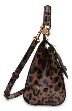 Signature Dolce&Gabbana panache and modern aesthetics merge on this leopard-print coated calf hair handbag from the Kim Kardashian runway collection. Magnetic-snap flap closure Top carry handle; removable, adjustable shoulder strap Interior zip and wall pockets Structured silhouette with flat base and protective metal feet Leather lining Genuine calf hair (China) Made in Italy Designer Handbags Designer Leopard Print Travel Bag, Leopard Print Leather Shoulder Bag With Top Handle, Designer Rectangular Bag In Leopard Print, Top Handle Bags In Leopard Print, Evening Shoulder Bag In Leopard Print With Detachable Strap, Designer Leather Bags In Leopard Print, Leopard Print Leather Bag With Gold-tone Hardware, Leopard Print Leather Top Handle Bag, Leopard Print Bag With Double Top Carry Handle