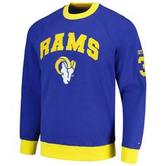 The Tommy Hilfiger Royal Los Angeles Rams Reese Raglan Tri-Blend Pullover Sweatshirt is the perfect way to show your support for the Los Angeles Rams. Made from a comfortable cotton, polyester, and spandex blend, this midweight sweatshirt features raglan sleeves and an embroidered fabric applique that proudly displays the Rams logo. Whether you're cheering from the stands or relaxing at home, this sweatshirt will keep you warm and stylish. Embroidered fabric applique Raglan sleeves Crew neck Mid Tommy Hilfiger Streetwear Sweatshirt, Tommy Hilfiger Long Sleeve Sweatshirt For Streetwear, Tommy Hilfiger Crew Neck Sweatshirt For Streetwear, Tommy Hilfiger Cotton College Tops, Tommy Hilfiger Long Sleeve Streetwear Tops, Sporty Long Sleeve Tommy Hilfiger Sweatshirt, Fan Apparel Long Sleeve Sweater With Ribbed Cuffs, Fan Apparel Sweater With Ribbed Cuffs, Tommy Hilfiger Sporty Long Sleeve Sweatshirt