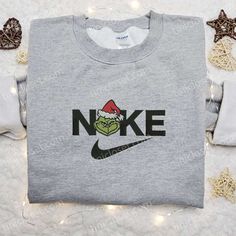 The Grinch Xmas x Nike Movie Embroidered Sweatshirt is the perfect blend of holiday cheer and athletic style. Featuring the Grinch Head, Nike Christmas, Disney Character Shirts, Walt Disney Characters, Mike Wazowski, Cartoon Shirts, Cartoon Sweatshirts, Patrick Star, Hoodie Material