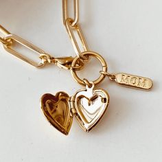 18k Gold Paperclip Style chain with a 18K Gold Heart locket and a dainty mom tag. Mother's Day Heart Charm Locket Necklace Gift For Mom, Dainty Gold Locket Necklace With Charms, Gold Locket Necklace For Mom On Valentine's Day, Mother's Day Locket Necklace With Charms, Gold Locket Necklace Gift For Mom, Gold Locket Necklace, Gift For Mom, Gold Locket Necklace For Mom, Yellow Gold Charms With Adjustable Chain For Gift, Personalized Gold Locket Necklace For Mom