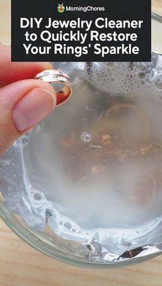 a person holding a ring in a glass bowl