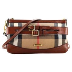 This bag is convertible.  Can be used as a shoulder bag, a crossbody or a clutch! This Burberry Bridle Peyton House Check Tartan Leather Fabric Shoulder Crossbody Bag is a must-have for any fashion-forward woman. With a stunning beige exterior made of leather and cotton, this medium-sized bag features a zip closure and studded accents. The bag width is 9.5 inches, and the bag height is 5.2 inches, making it the perfect size for everyday use. The interior is lined with beige fabric and features a brown leather handle/strap material. The bag is part of the Burberry Bridle product line, and its style is a crossbody. The bag is not vintage and has a modern 80s theme. The hardware color is gold, and the handle/strap material is also leather. This bag is perfect for any occasion and is sure to e 80s Theme, Burberry Models, Medium Sized Bags, Beige Fabric, Black Hardware, Leather Fabric, Burberry Bag, Leather Handle, Louis Vuitton Damier