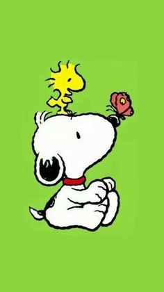 a snoopy dog with a flower on top of it's head