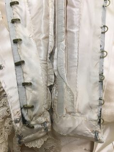 "Museum Deaccession: Beautiful and rare ladies Historical Wedding Ensemble dated to the early 1890s in great condition. As you can see from the photos, it presents quite well. Hand made in New York by A F Jammes with fine couture detailing for a Miss EB Jennings. (hand written on a sewn in piece of silk) Both pieces are 100% Silk Duchess Satin in a Golden Champagne color Fitted Bodice: Falls to natural waist at sides but dips down in the front and back High neck bodice trimmed down the front wit Regency Style Wedding Corset With Historical Design, Regency Style Historical Wedding Corset, Victorian Corset With Historical Design For Formal Occasions, Regency Style Wedding Corset With Boned Bodice, Victorian Vintage Wedding Dress With Overbust, Victorian Corset With Historical Design For Wedding, Victorian Wedding Corset With Historical Design, Vintage Formal Corset With Fitted Bodice, White Victorian Wedding Corset