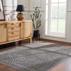 an area rug is shown in front of a window