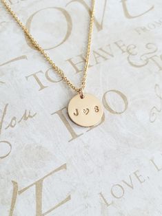 "Couples Initial Necklace - 14K Gold Filled - Mothers Gift - Name Necklace - Initial Necklace - Personalized Necklace - Gift for Her - 11mm * Dimensions: 11mm Diameter 14K Gold Filled Circle Disc Pendant * Necklace Chain Length: Available in 14in, 16in, or 18in ---------------------------------- HOW TO ORDER 1. Select the length that you would like from the drop down menu. * This item only comes in Font Type 3 (1.5mm)* This listing is for (1) necklace. Please feel free to let us know if you have 14k Gold Necklace For Valentine's Day, Elegant Hand Stamped 14k Gold Jewelry, Elegant 14k Gold Hand Stamped Jewelry, 14k Gold Charm Necklace For Anniversary, 14k Stamped Jewelry For Valentine's Anniversary, Dainty Hand Stamped Necklaces For Anniversary, Dainty Stamped Necklace For Anniversary, Valentine's Day Jewelry With Initials On Round Pendant, 14k Gold Stamped Round Pendant Necklace