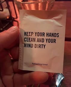 a hand holding a piece of paper that says keep your hands clean and your mind dirty