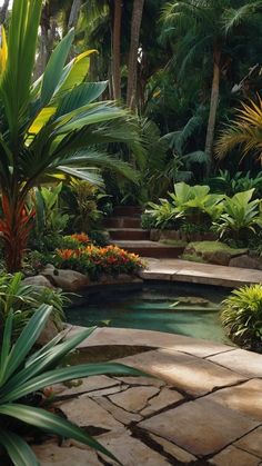 an outdoor pool surrounded by tropical plants and trees