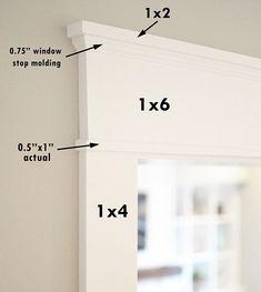 measurements for the top and bottom of a window frame in a room with white walls