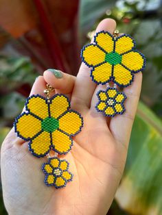 Handmade beaded earrings flowers. Care Instructions: To maintain their beauty, gently wipe with a soft cloth and store in a dry, cool place. Avoid exposure to water and harsh chemicals. Handwoven Yellow Beaded Earrings With Round Beads, Yellow Handwoven Beaded Earrings With Round Beads, Yellow Flower Earrings With Colorful Beads For Gift, Yellow Flower-shaped Beaded Earrings, Yellow Beaded Flower Earrings, Yellow Flower Beaded Earrings, Yellow Flower Earrings With Colorful Beads, Handmade Yellow Flower Beaded Earrings, Yellow Flower Beaded Earrings For Gift